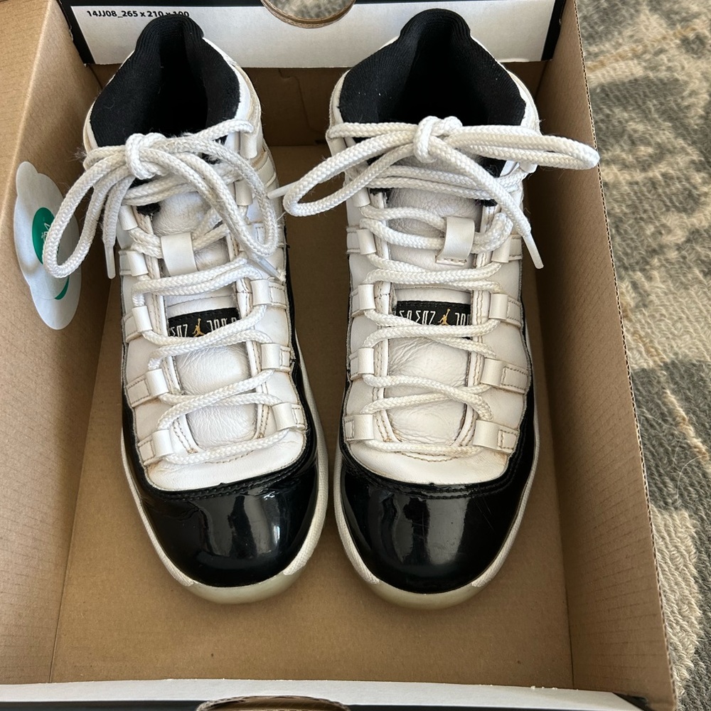 Kids Jordan 11 Retro Black and White Sneakers
